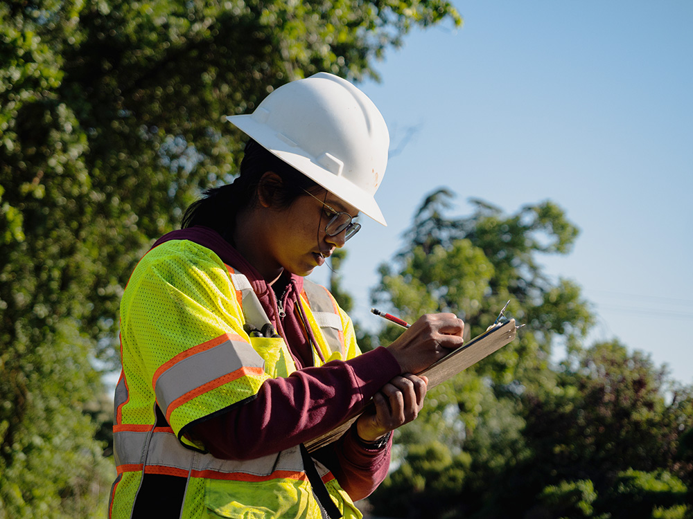 Student taking notes wearing PPE